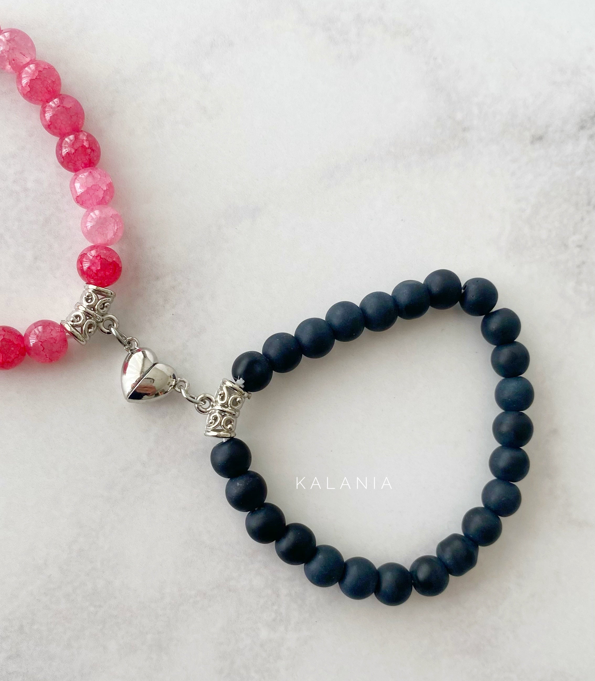 PULSERAS UNIÓN ROSADO Y NEGRO