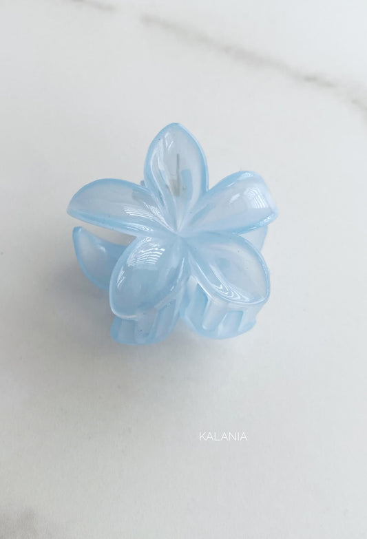 HAIR CLIPS FLORES HAWAIANA CELESTE TRANSPARENTE