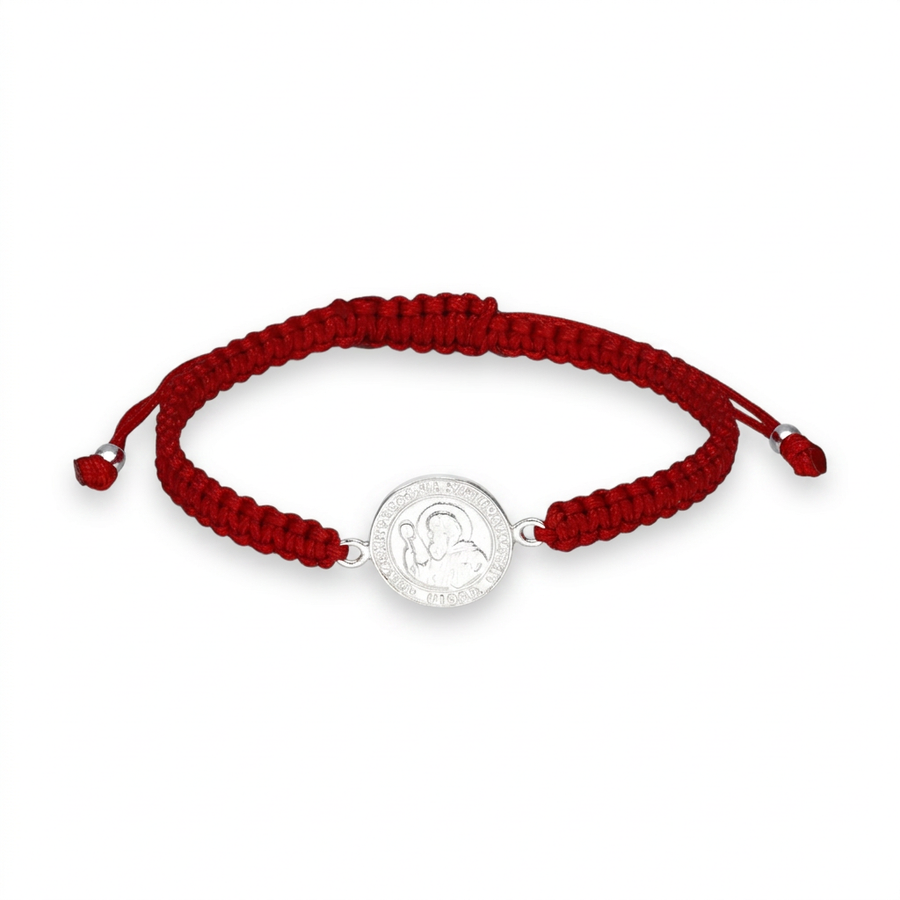 Pulsera Baby roja San Benito Abad con medalla plateada sobre fondo blanco